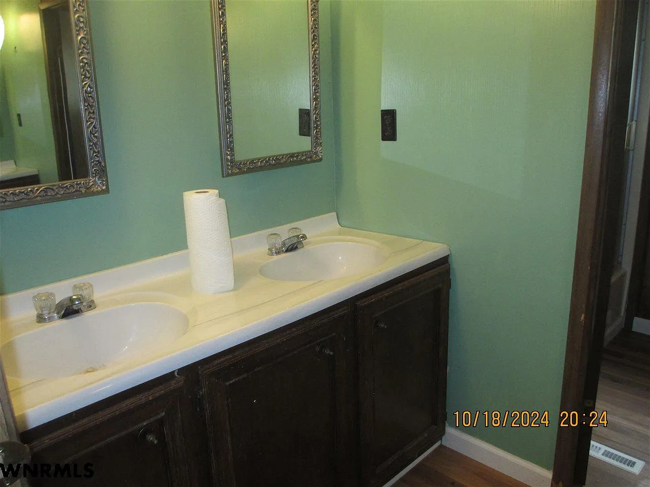 Bad Real Estate Photo Example: Photographer visible in mirror reflection of bedroom closet doors