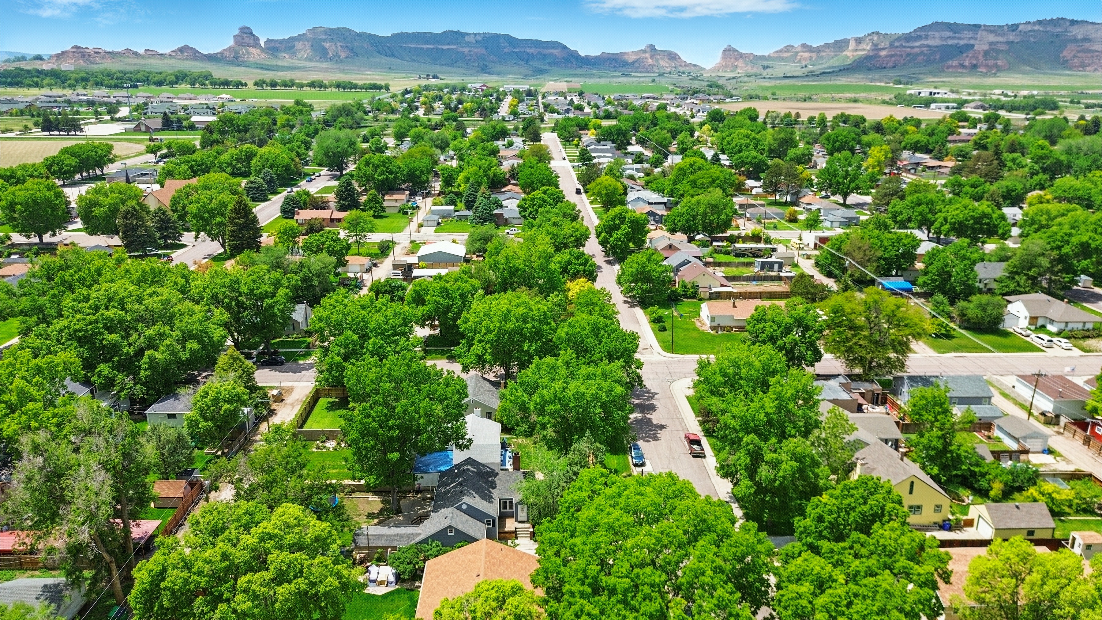 Drone perspective of residential property in established community showing neighborhood context